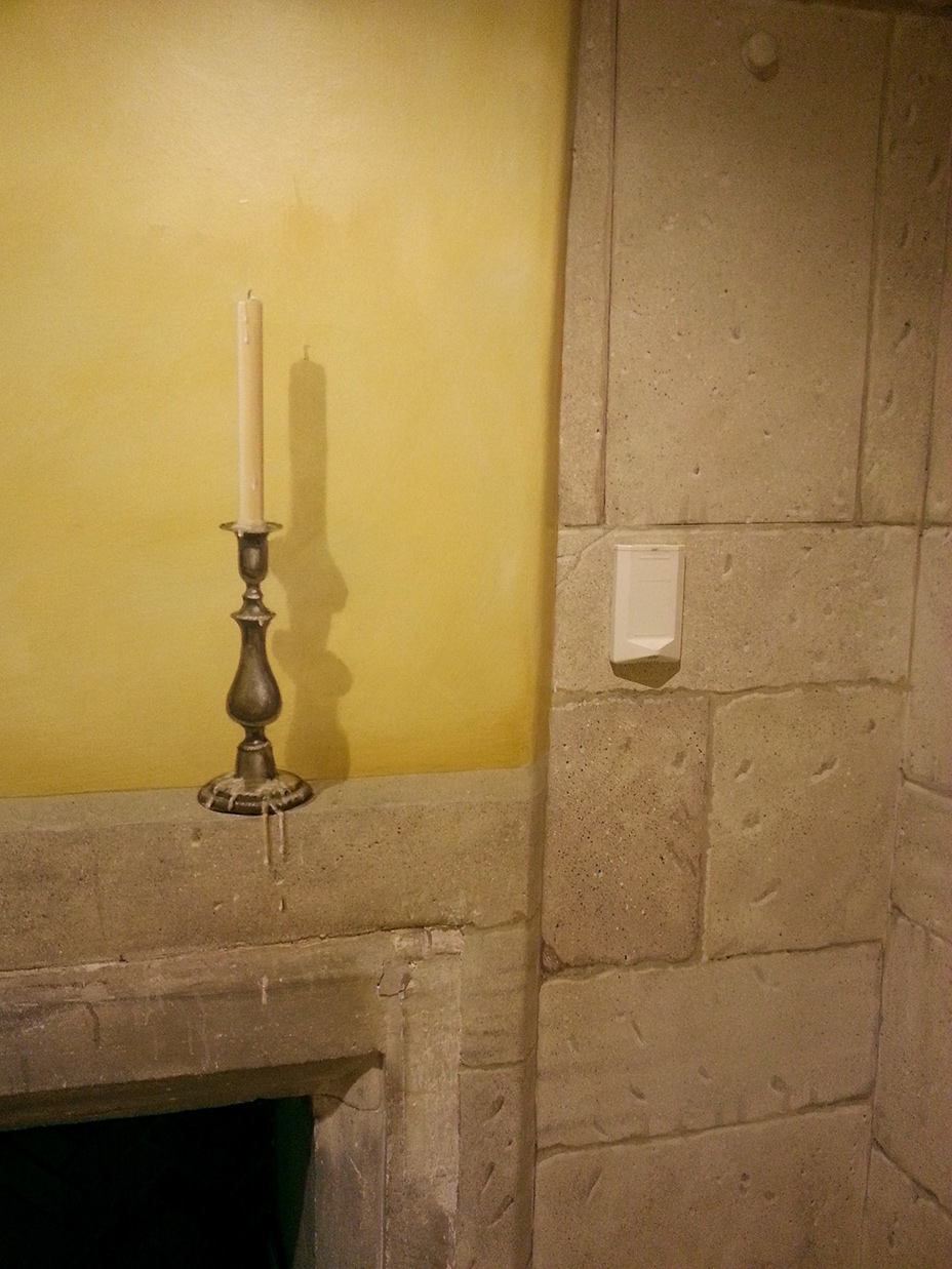 Trompe L'oeil candles and stone blocking